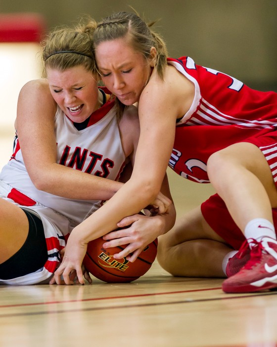 Hannah Mocaby (left) fights for a loose ball against SWOCC.