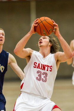 Freshman Mac Johnson goes up for a lay-up against Linn-Benton. Johnson scored 10 points in the Saints' win.