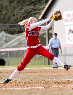 Freshman Kristen Crawford winds up for a pitch against Centrailia March 28. The Saints won both games in the double header, with a 11-0 score for the first game and 7-2 in the second.