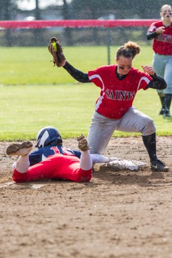  Freshman Teauna Hughes braces herself as a Lower Columbia player slides into second base at Tuesday’s game. 