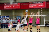 Freshman Devin Saucy tips the ball over the net towards a Blue Mountain defender the NWAACC’s.