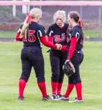 Outfielders Laura Lesowske, SheaLee Lindsay and Kelsey Reams come together during Tuesday game against Lower Columbia