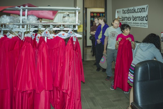 Graduating students borrowing gowns from ASG.