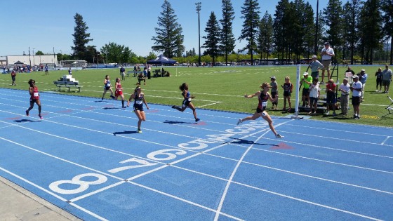 Sophomore Margaret Paul  crosses finish line at the NWAC Track and Field Championships in Spokane,WA. She won both the 100 meter and the 200 meter dash. Paul was also named track athelete of the meet.