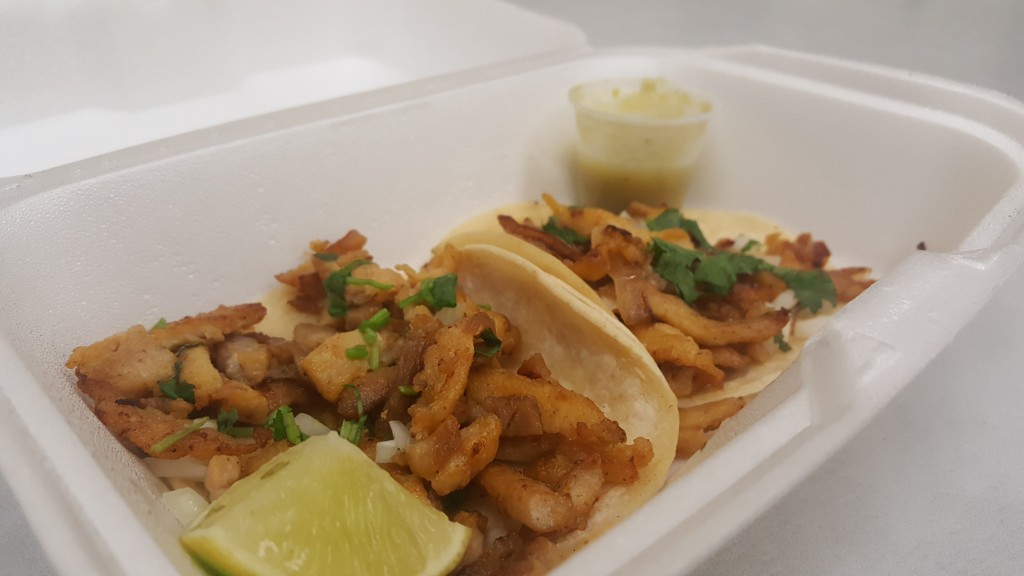 Two of the most delicious tacos you will ever have in your life. The tacos come with both a lime wedge and your choice of green or red salsa.