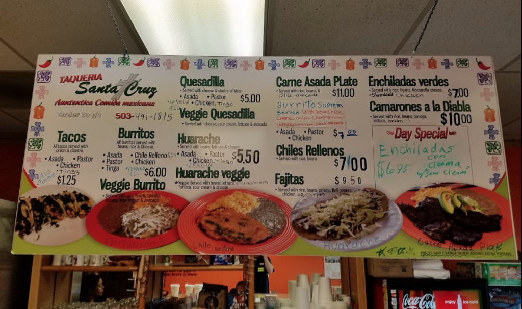 The large menu board at Taqueria Santa Cruz featuring some hand written addition to the menu, giving the business even more character. Both photos pulled from web.
