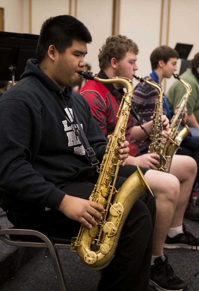 Michael Tran and bandmates practicing for their performance on Nov. 30. Photo taken by Porcha Hesselgesser.