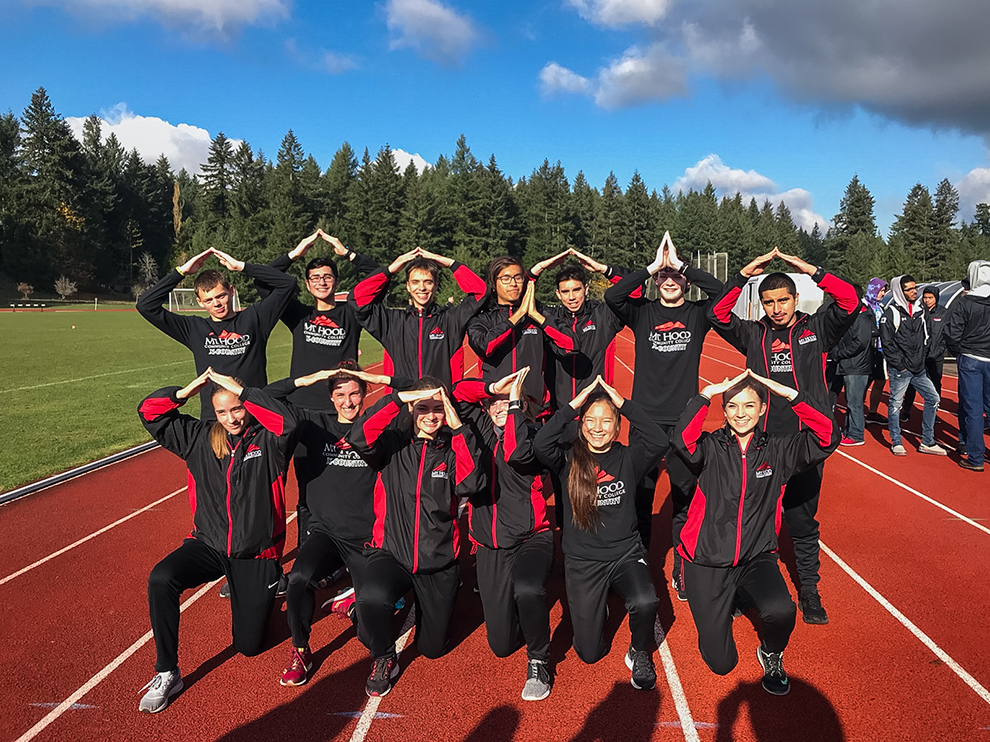 Cross country team poses the 'Mt. Hood Peak' at Saint Martin's University in Lacey, Washington before NWACs.