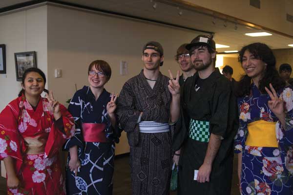 Members of the Japanese Club pose in their kimonos at the traditional teahouse event.