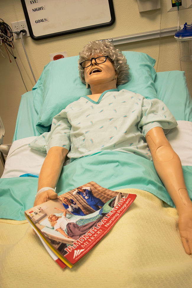 Close up image of a "human patient simulator" used in the Nursing program to simulate patient interactions.