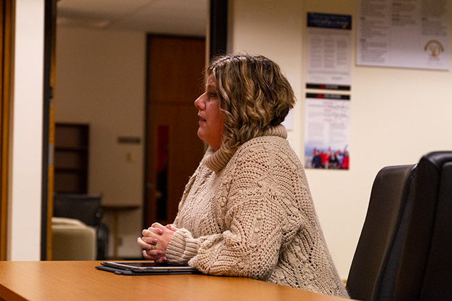 Photo of Jennifer DeMent discussing financials with the Board of Education.