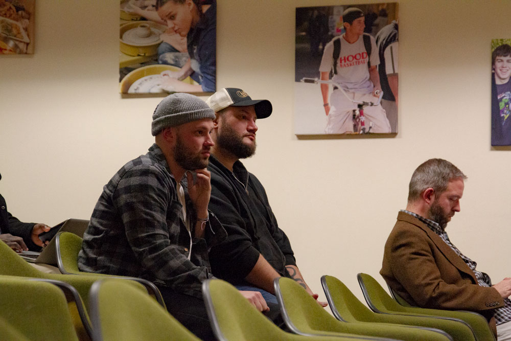 A photo of Devin Hardgrove and Ben "Benny King" Fitzhugh listening to the Board.
