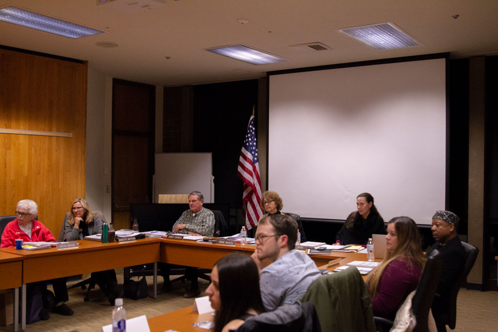 Photo of the Board of Education, the college president, and Associated Student Government members listening to public input.