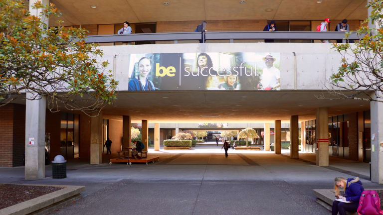 Photograph showing part of the MHCC campus, including a sign saying, 'BE: SUCCESSFUL.'