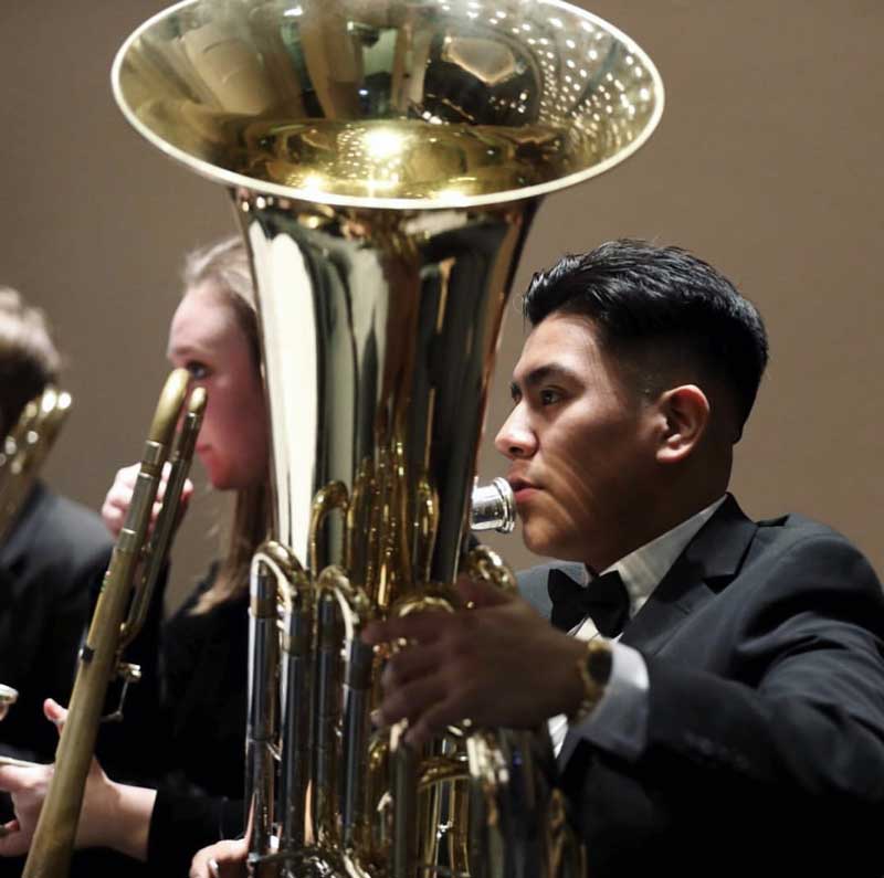 Emanuel Aguilar with his tuba at the concert.