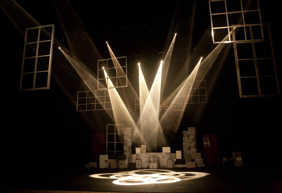 Theatre lighting on an empty stage in sepia tones.